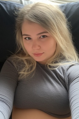 a girl with a grey shirt and long hair