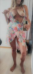 Naughty Chick Wearing Floral Dress Takes Selfie