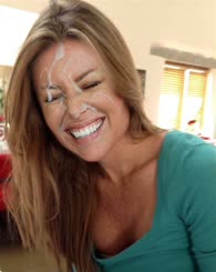 Blond Beauty Smiling and Playing with Cake on Her Face