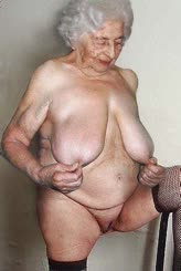 Naked Granny Exposing Her Large Breasts