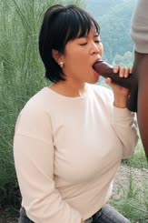 Asian Woman Feeds Black Man Masturbator: Outside