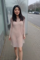 Barely covering girl walks down sidewalk in: floweD