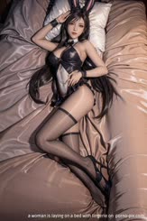 a woman is laying on a bed with lingerie on 