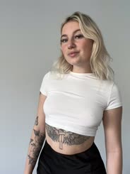 Blonde Girl with Tattoos Looks Confident in White Shirt: A Positive and Awesome Look at Self Expression and Individuality