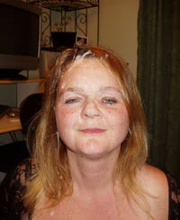  A woman with makeup on her face and a wet nose