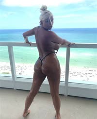 Busty Blonde Babe Posing Naked on Balcony