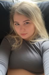 a girl with a grey shirt and long hair