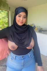 a woman with big tits and cum on her face