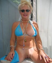 Mature Lady in Blue Bikini Flashing Her Pussy
