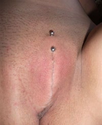 Intimate Moments: A Close Up of a Naked Body with a Piercing