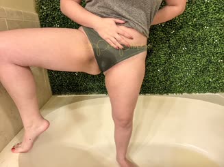 A Naughty Pussy Poses for a Photo in the Bathroom