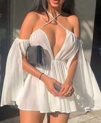 Sultry Summer: A Busty Beauty in a White Dress and Heels
