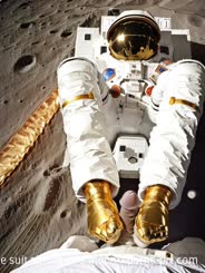 a person in a space suit sitting on a moon . 