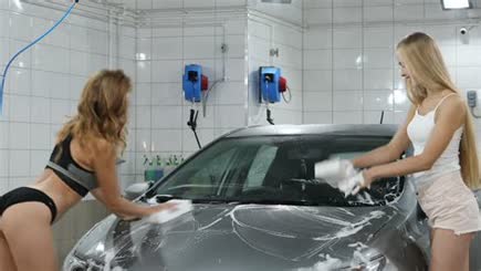 Car Wash. Sexy Two Happy Blonde Women In A Car Wash