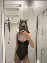 Cat Wearing Net in Bathroom Takes Selfie