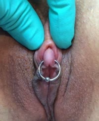 A person with a piercing in their genital area.
