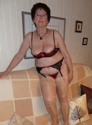 Older woman wearing lingerie and stockings.