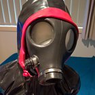 Layered latex hoods. Full enclosure hood first, then gasmask, hands handcuffed and then a latex hoodie on top. Had to focus not to panic. [F]